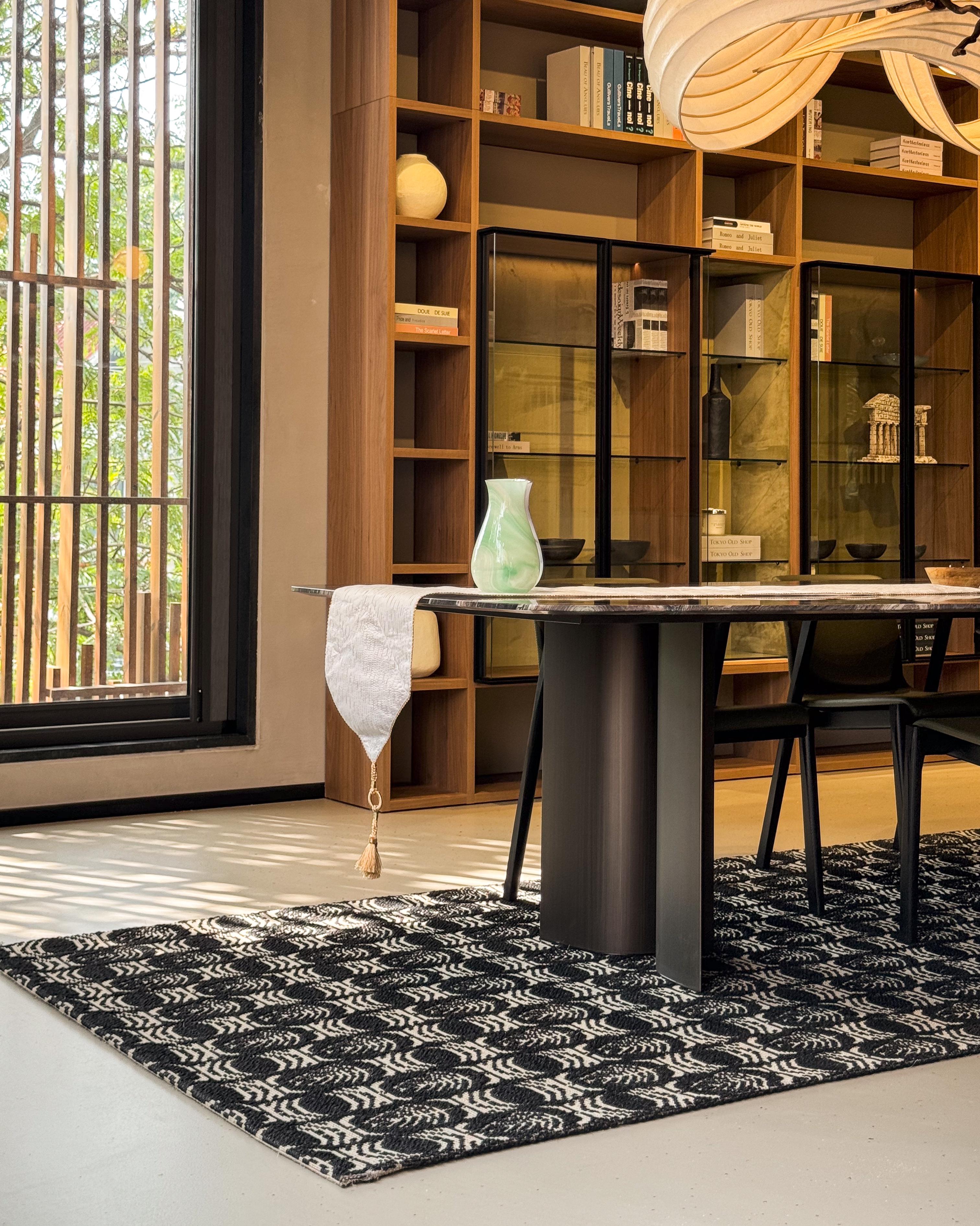 A living arrangement grounded by a handcrafted rug